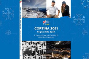 Copertina del libro dei Mondiali 2021 "Cortina. Regina dello Sport"